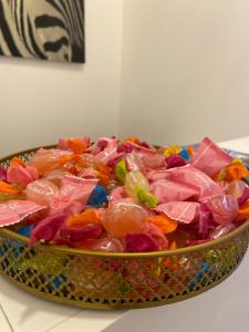 a bowl of candies in a bowl on a counter at RUMA GUESTHOUSE in Naples