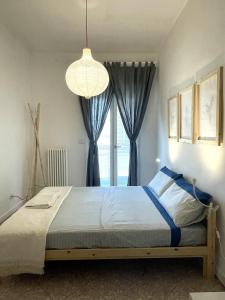Ένα ή περισσότερα κρεβάτια σε δωμάτιο στο EASYSTAY BARI Rooms +23 φωτογραφίες