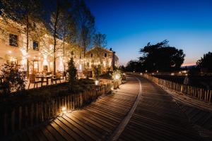 a building with lights on the side of a street at Le Hameau Des Pesquiers Ecolodge & Spa, Curio Collection By Hilton in Hyères