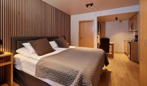 Postel nebo postele na pokoji v ubytování Hotel Frón