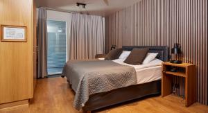 Postel nebo postele na pokoji v ubytování Hotel Frón