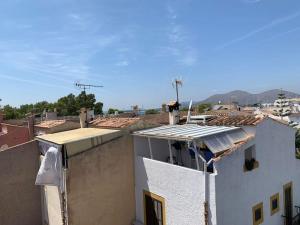 a view of the roofs of buildings in a city at Casa Dúplex en Puerto de Alcudia in Alcudia