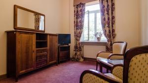 TV a/nebo společenská místnost v ubytování Hotel Łazienkowski