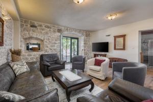 a living room with a couch and chairs at Villa Lavanda in Podgora