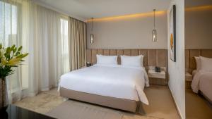 Postel nebo postele na pokoji v ubytování Hotel Royal ASBU Tunis