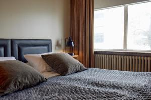 Postel nebo postele na pokoji v ubytování Hotel Frón