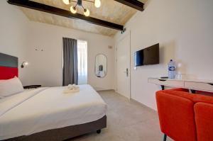 TV a/nebo společenská místnost v ubytování Private rooms with bathroom in Valletta