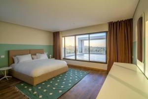 Ένα ή περισσότερα κρεβάτια σε δωμάτιο στο Lourina at Lake View Residence