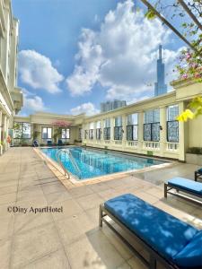 a swimming pool in the middle of a building at Diny ApartHotel - Rooftop Pool - The Manor 2 in Ho Chi Minh City