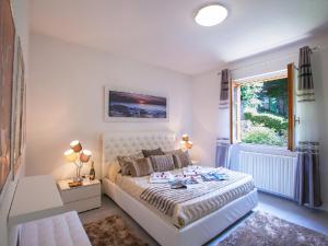 En eller flere senge i et værelse på Villa Lakecomo - Ritrovo