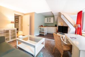 a living room with a couch and a table at Gasthof Engel in Ravensburg