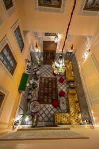 an overhead view of a living room with a table at Riad Diamant De Fes in Fez