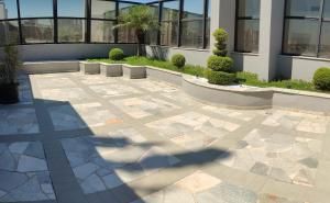 a shadow of a building on a patio at Apart Hotel 48 in Mogi das Cruzes
