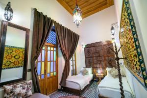 Postel nebo postele na pokoji v ubytování Riad Diamant De Fes