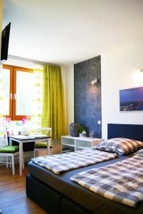 En eller flere senge i et værelse på Apartments Rummelsburger Bucht am Ostkreuz