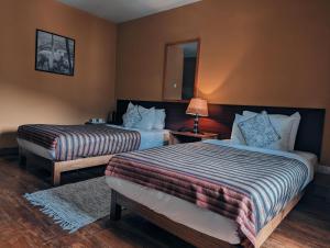 Ένα ή περισσότερα κρεβάτια σε δωμάτιο στο Hotel Amodhara