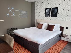 Postel nebo postele na pokoji v ubytování Hotel de Wereld