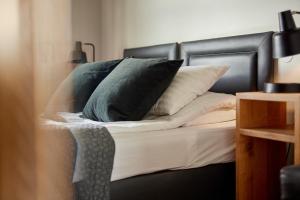 Postel nebo postele na pokoji v ubytování Hotel Frón