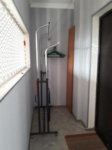 a hallway with a shower in a room at Zhenis street in Astana