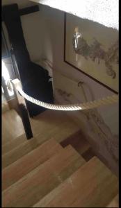 a staircase with a rope tied to a wall at Casa Ada - Incantevole loft in centro in Lampedusa