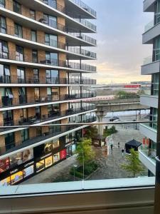 a view from a window of a large building at Stylish Apartment Docklands in London