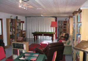 a living room with a pool table in a library at Doonreagan West Wing, Cashel in Canower