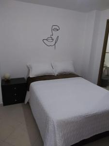 Ein Bett oder Betten in einem Zimmer der Unterkunft MALAGA