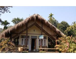 a small building with a thatched roof at Manas Motel Eco Tourist Lodge, Khuthuri Jhar, Assam in Jyoti Gaon