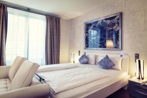 Een bed of bedden in een kamer bij Hotel Ambiance Rivoli