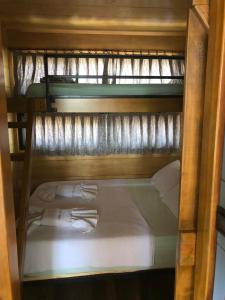 a couple of bunk beds in a room at Tiny house kayaköy kumquat in Kayakoy