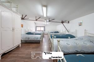 Katil atau katil-katil dalam bilik di Somptueuse Villa Jasmine +12 gambar
