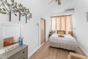 a bedroom with a bed and a mirror in it at Casa Loba Suite 2 at 413 with private pool in Rincon +19 photos