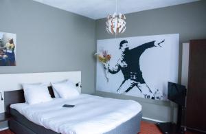 Postel nebo postele na pokoji v ubytování Hotel de Wereld