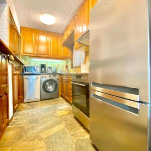 A kitchen or kitchenette at Villa Naya by the Beach