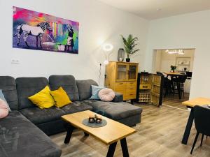 a living room with a couch and a table at Fewo am Wiesengrund in Lüdinghausen