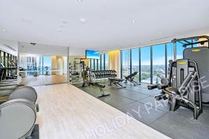 a gym with treadmills and machines in a building at Luxury S Casino Residences Broadbeach - Holiday Paradise in Gold Coast