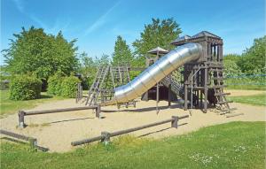 a playground with a slide in a park at Shjlandet in Gjern