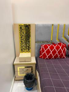 een model van een bed met een laptop erop bij Elegant Guest House Karachi in Karachi