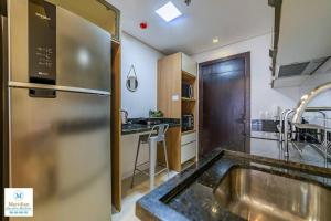 Η κουζίνα ή μικρή κουζίνα στο 1F Flats del Sol - A pasos del Shopping del Sol