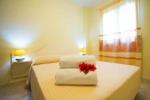 Postel nebo postele na pokoji v ubytování Relaxing Le Residenze del Maria Rosaria no2210 sleeps 3 persons