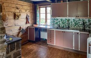 a kitchen with a sink and a counter top at Gorgeous Home In Vittsj With House A Panoramic View in Vittsjö