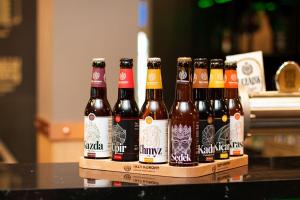 a group of bottles of beer sitting on a table at Zakarczmie Stokrotka in Leżajsk