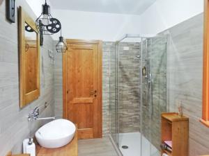 a bathroom with a shower and a toilet and a sink at Casa vacanza Flora in Grottazzolina