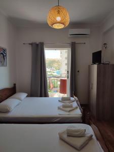 Postel nebo postele na pokoji v ubytování Duka Rooms