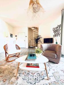 a living room with a couch and a table at Casa Azul Apartment in Porto San Giorgio