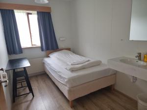 Postel nebo postele na pokoji v ubytování Litla-Hof Guesthouse