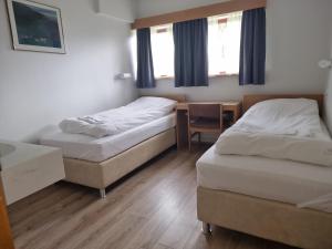 Postel nebo postele na pokoji v ubytování Litla-Hof Guesthouse