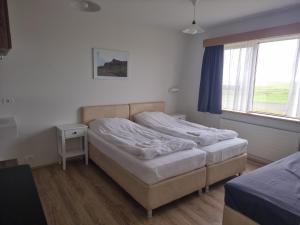 Postel nebo postele na pokoji v ubytování Litla-Hof Guesthouse