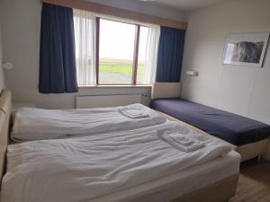 Postel nebo postele na pokoji v ubytování Litla-Hof Guesthouse