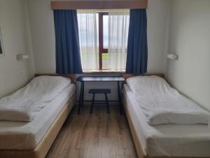 Postel nebo postele na pokoji v ubytování Litla-Hof Guesthouse